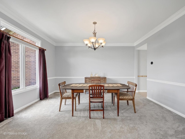 carpeted dining area featuring a chandelier, crown molding, and baseboards