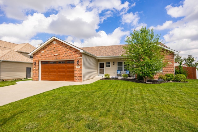 view of front of house featuring brick siding, concrete driveway, an attached garage, a front yard, and a porch