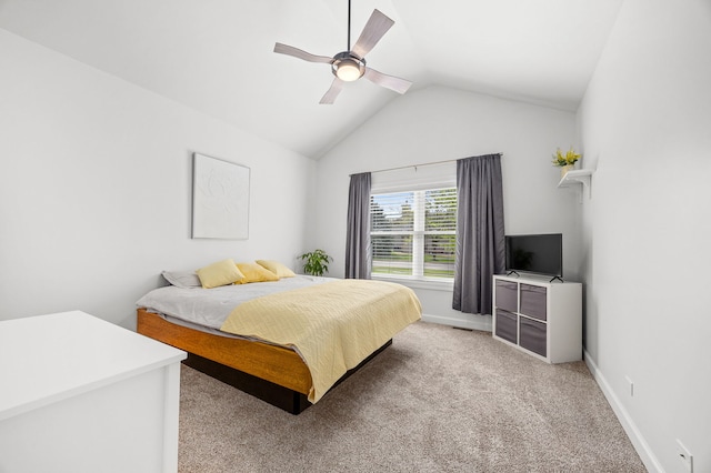 bedroom with lofted ceiling, light colored carpet, a ceiling fan, and baseboards