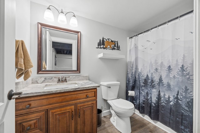 full bath with wood finished floors, vanity, toilet, and a shower with curtain