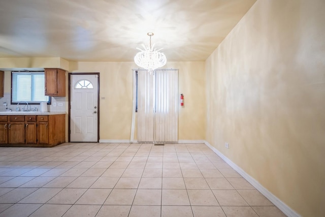 12215 S Green St, Chicago, IL 60643 - interior space featuring a chandelier, light tile patterned floors, baseboards, and a sink