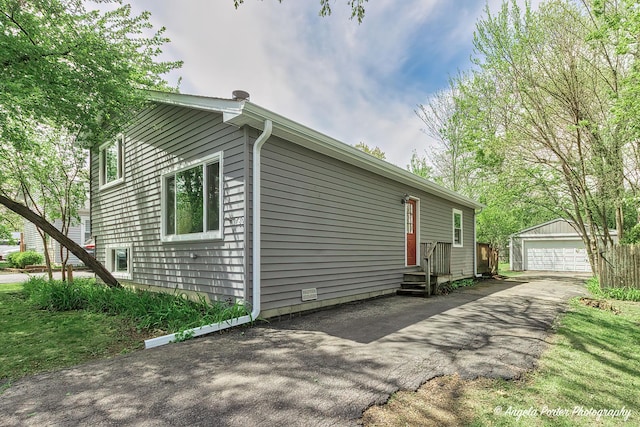 782 N Hainesville Rd, Round Lake, IL 60073 - view of side of property with an outbuilding, entry steps, and a garage