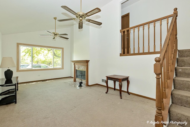 782 N Hainesville Rd, Round Lake, IL 60073 - living area with carpet flooring, baseboards, stairs, a premium fireplace, and a ceiling fan