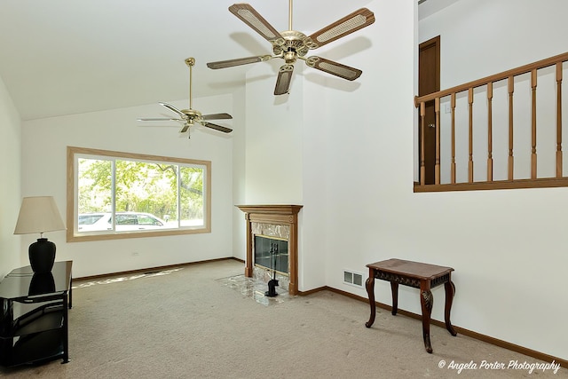 782 N Hainesville Rd, Round Lake, IL 60073 - carpeted living area with ceiling fan, baseboards, a high end fireplace, and vaulted ceiling
