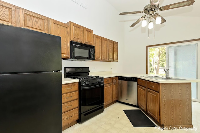 782 N Hainesville Rd, Round Lake, IL 60073 - kitchen featuring black appliances, a sink, a peninsula, light countertops, and brown cabinetry