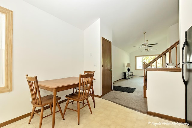 782 N Hainesville Rd, Round Lake, IL 60073 - dining room featuring lofted ceiling, a ceiling fan, baseboards, light flooring, and light colored carpet