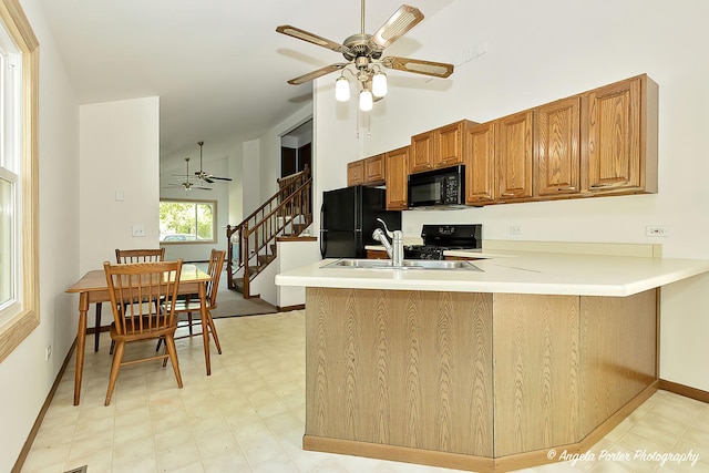 782 N Hainesville Rd, Round Lake, IL 60073 - kitchen featuring black appliances, ceiling fan, a peninsula, brown cabinets, and baseboards