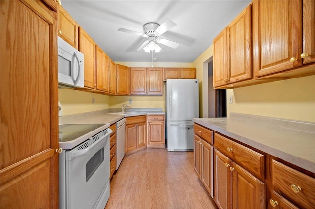 1502 Woodbridge Rd Unit 1D, Joliet, IL 60436 - kitchen with white appliances, light wood-type flooring, light countertops, and a ceiling fan