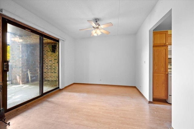 1502 Woodbridge Rd Unit 1D, Joliet, IL 60436 - empty room featuring light wood finished floors, a ceiling fan, and baseboards