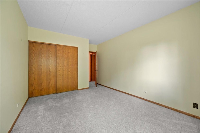 1502 Woodbridge Rd Unit 1D, Joliet, IL 60436 - unfurnished bedroom with carpet, a closet, and baseboards