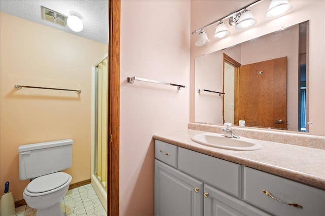 1502 Woodbridge Rd Unit 1D, Joliet, IL 60436 - bathroom featuring a stall shower, toilet, vanity, baseboards, and a textured ceiling