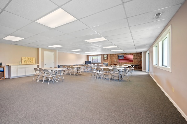 1502 Woodbridge Rd Unit 1D, Joliet, IL 60436 - carpeted dining space featuring a drop ceiling and baseboards