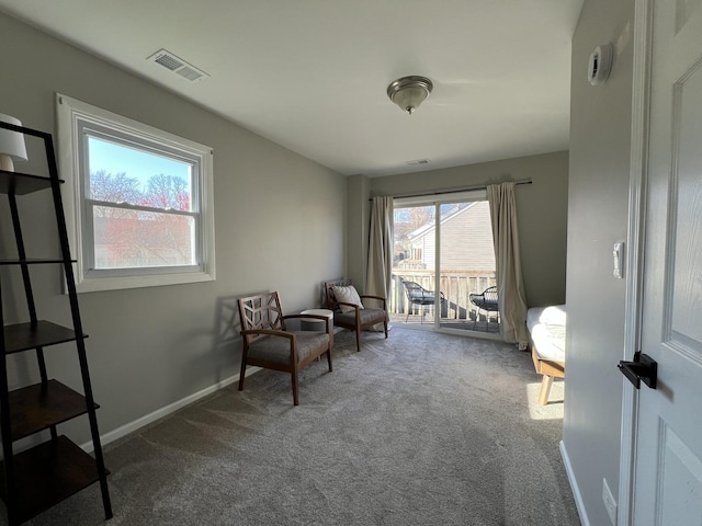 living area with carpet