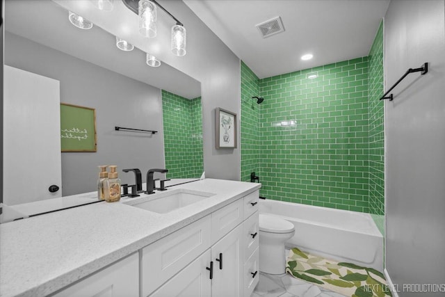 bathroom with toilet, bathtub / shower combination, vanity, and marble finish flooring