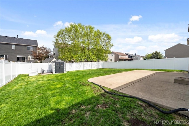 view of yard with a storage unit, a patio, and an outdoor structure