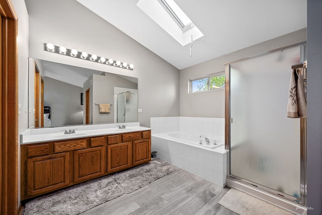 1913 Apple Valley Rd, Bolingbrook, IL 60490 - bathroom with a skylight, vaulted ceiling, wood finished floors, a garden tub, and a shower stall