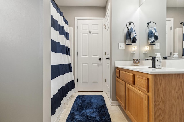 423 W Taylor St W, Dekalb, IL 60115 - bathroom with vanity, tile patterned floors, and a shower with shower curtain