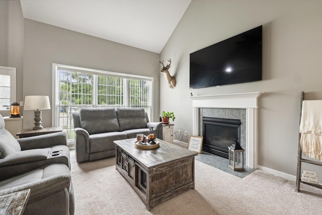 423 W Taylor St W, Dekalb, IL 60115 - living area featuring carpet flooring, healthy amount of natural light, a fireplace, and vaulted ceiling