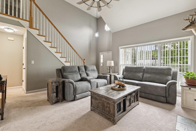 423 W Taylor St W, Dekalb, IL 60115 - living area with light colored carpet, high vaulted ceiling, ceiling fan, and stairway