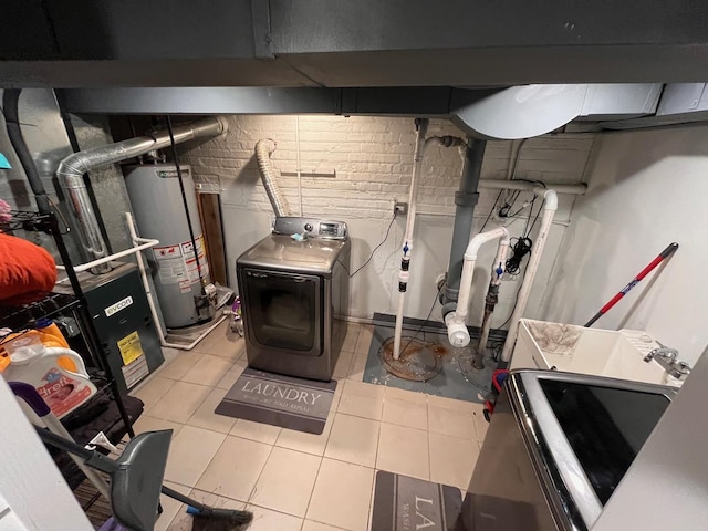 638 Paxton Ave, Calumet City, IL 60409 - unfinished basement with washer / dryer, water heater, and tile patterned floors