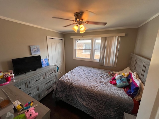638 Paxton Ave, Calumet City, IL 60409 - bedroom featuring a closet, crown molding, and ceiling fan