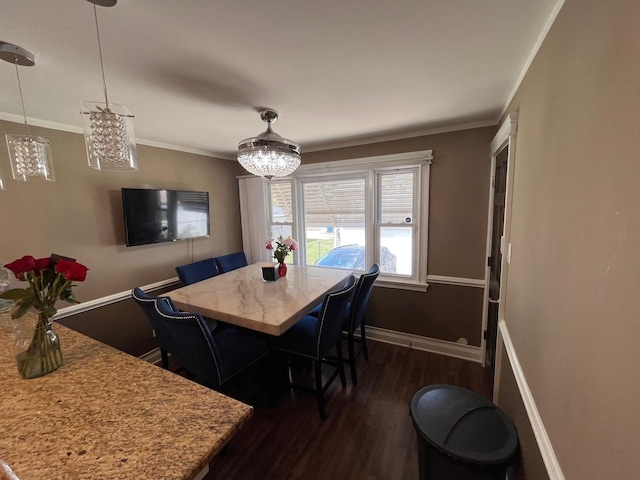 638 Paxton Ave, Calumet City, IL 60409 - dining area with dark wood finished floors, crown molding, and baseboards