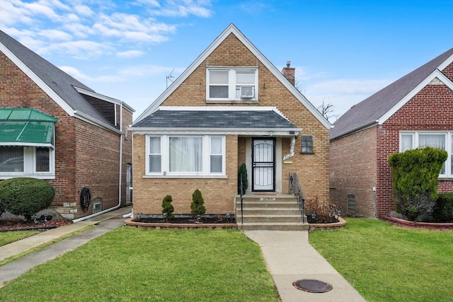 8020 S Mozart St, Chicago, IL 60652 - view of front of property featuring roof with shingles, a chimney, brick siding, and a front lawn