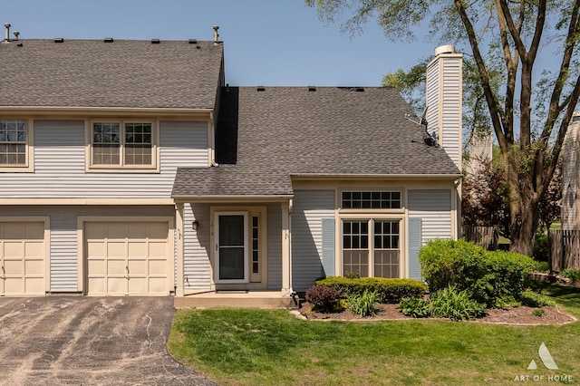 1016 N Knollwood Dr, Palatine, IL 60067 - view of front of home featuring a chimney, asphalt driveway, a garage, and roof with shingles