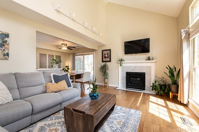 1016 N Knollwood Dr, Palatine, IL 60067 - living room with wood finished floors, healthy amount of natural light, a high end fireplace, a ceiling fan, and a high ceiling