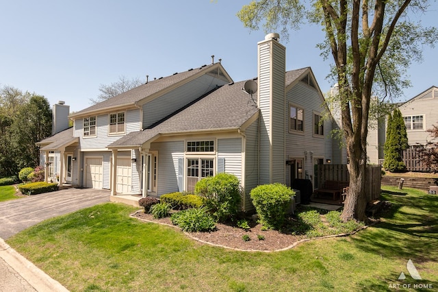 1016 N Knollwood Dr, Palatine, IL 60067 - view of front of house featuring driveway, a chimney, a front yard, and a shingled roof