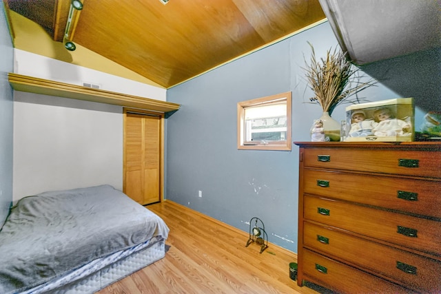 1311 Harvey Ave, Berwyn, IL 60402 - bedroom featuring wood finished floors, vaulted ceiling, and a closet