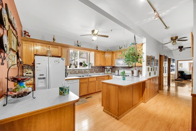 1311 Harvey Ave, Berwyn, IL 60402 - kitchen with white appliances, a ceiling fan, a sink, a peninsula, and light countertops