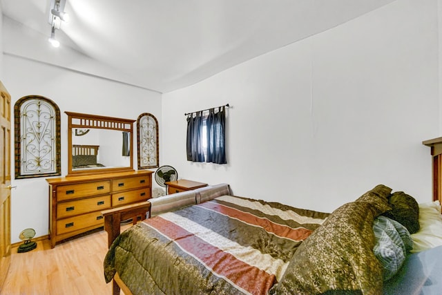 1311 Harvey Ave, Berwyn, IL 60402 - bedroom with light wood-type flooring, vaulted ceiling, and track lighting