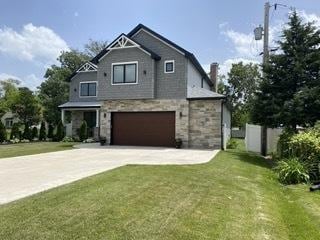 313 Roger Rd, Darien, IL 60561 - view of front facade featuring driveway, stone siding, an attached garage, and a front yard