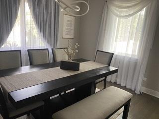 313 Roger Rd, Darien, IL 60561 - dining room with baseboards and wood finished floors