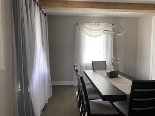 313 Roger Rd, Darien, IL 60561 - dining area featuring baseboards and beamed ceiling