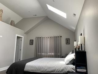 313 Roger Rd, Darien, IL 60561 - bedroom with a skylight, vaulted ceiling, and baseboards