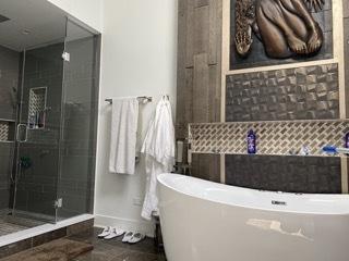 313 Roger Rd, Darien, IL 60561 - full bath with a soaking tub, baseboards, and a stall shower