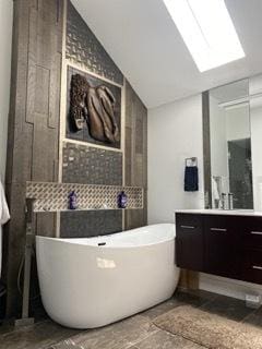 313 Roger Rd, Darien, IL 60561 - bathroom with vanity, a soaking tub, vaulted ceiling, and a skylight