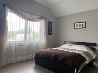 313 Roger Rd, Darien, IL 60561 - bedroom featuring lofted ceiling and wood finished floors