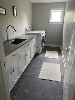 313 Roger Rd, Darien, IL 60561 - washroom featuring cabinet space, washer and dryer, and baseboards