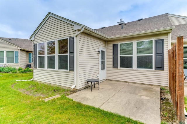 604 S Essington Dr, Round Lake, IL 60073 - back of house featuring a patio area, a yard, and roof with shingles