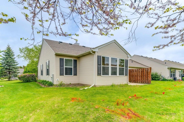 604 S Essington Dr, Round Lake, IL 60073 - rear view of property with a yard