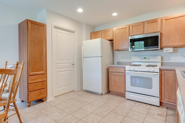 604 S Essington Dr, Round Lake, IL 60073 - kitchen featuring white appliances, light countertops, recessed lighting, light tile patterned floors, and light brown cabinets