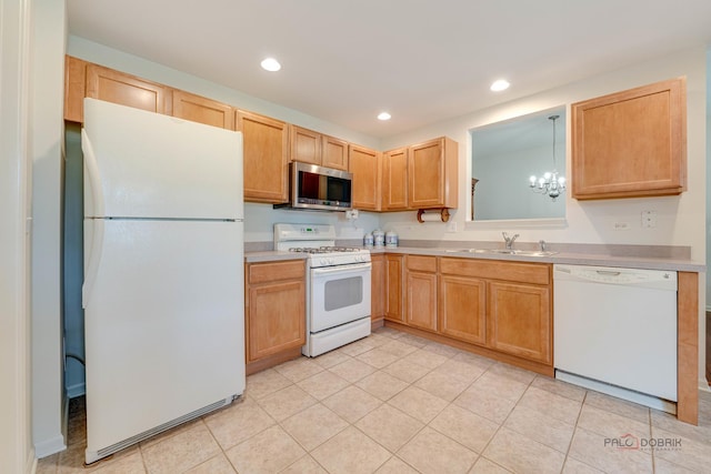 604 S Essington Dr, Round Lake, IL 60073 - kitchen with white appliances, a sink, light countertops, recessed lighting, and light tile patterned floors