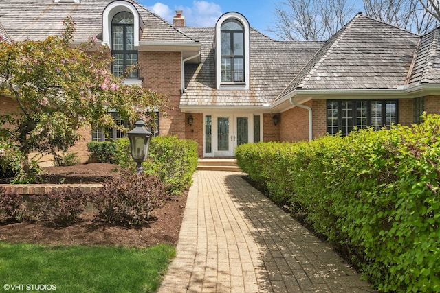 80 Gaelic Ct, Inverness, IL 60010 - property entrance with brick siding and a chimney