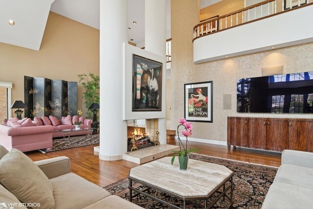80 Gaelic Ct, Inverness, IL 60010 - living area with high vaulted ceiling, wood finished floors, baseboards, and a fireplace