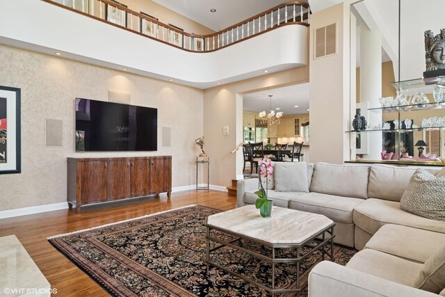 80 Gaelic Ct, Inverness, IL 60010 - living area featuring a chandelier, wood finished floors, and baseboards