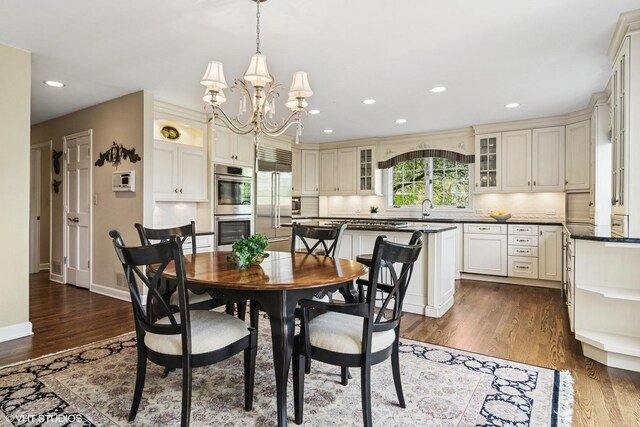 80 Gaelic Ct, Inverness, IL 60010 - dining area with dark wood-style floors, a chandelier, recessed lighting, and baseboards