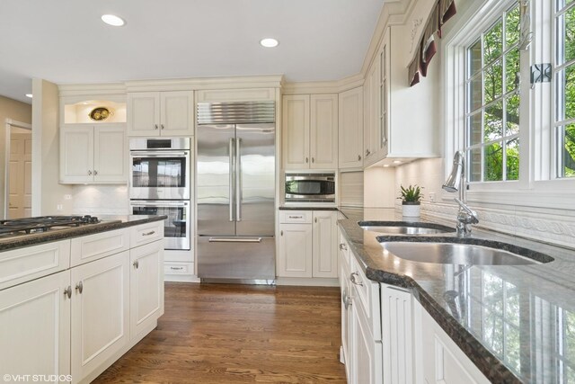 80 Gaelic Ct, Inverness, IL 60010 - kitchen with built in appliances, a sink, healthy amount of natural light, recessed lighting, and backsplash